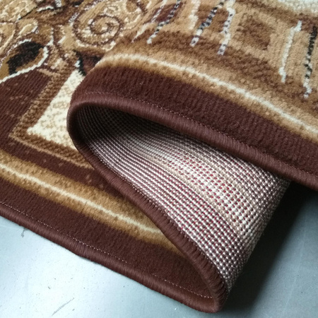 Brązowy chodnik dywanowy na metry BCF Alfa 11 – klasyczny wzór liści, szer. 100 cm
