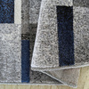 Nowoczesny dywan geometryczny szary z niebieskimi elementami OTTO 09 - 200x290 cm